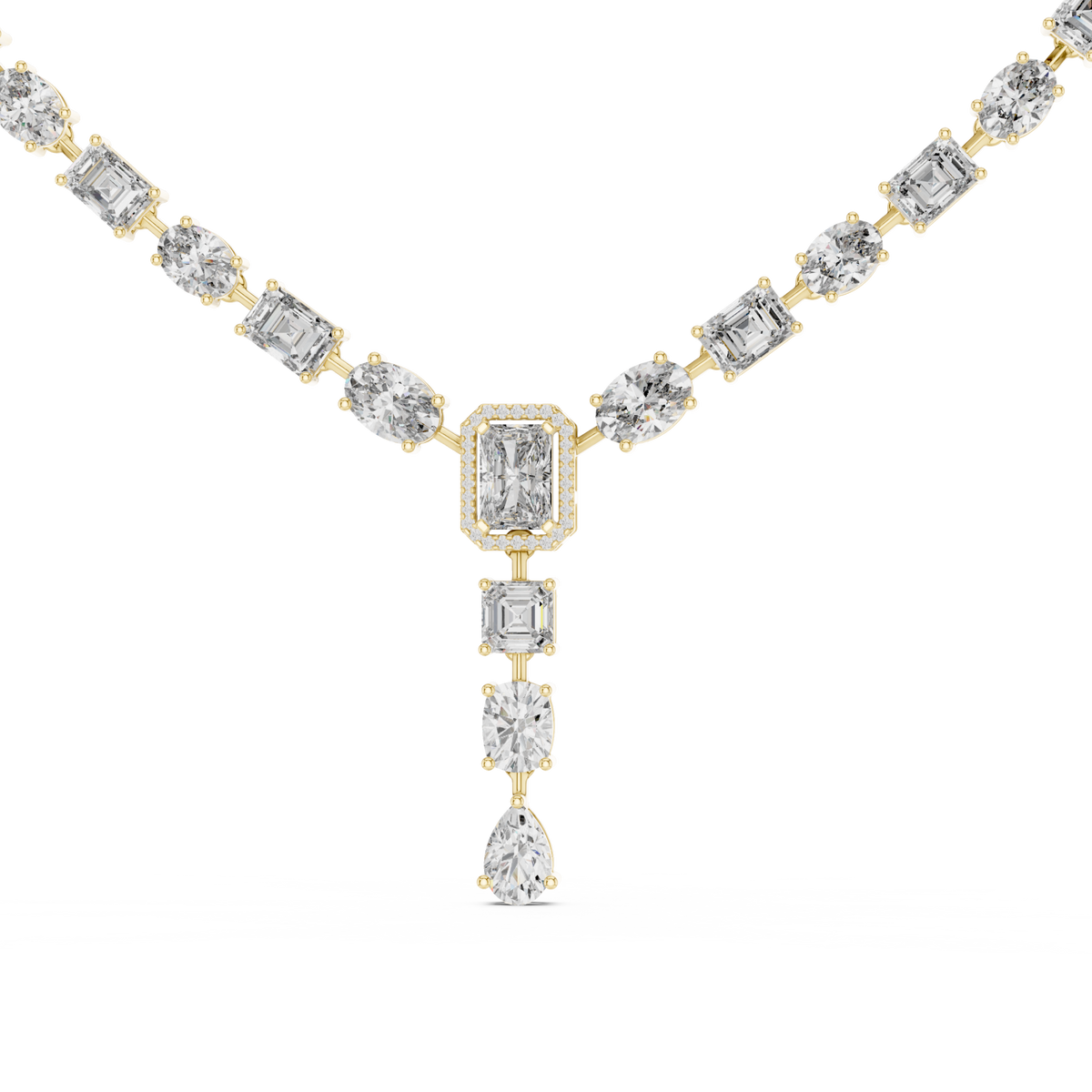East-west oval and emerald-cut y-drop necklace yellow gold detail view