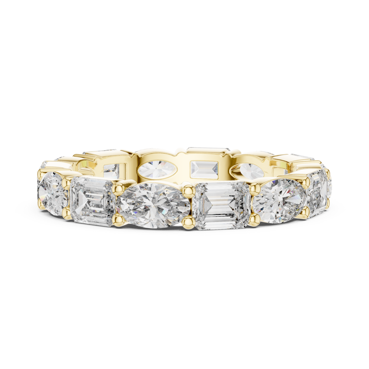 East-west oval and emerald eternity band yellow gold angle view