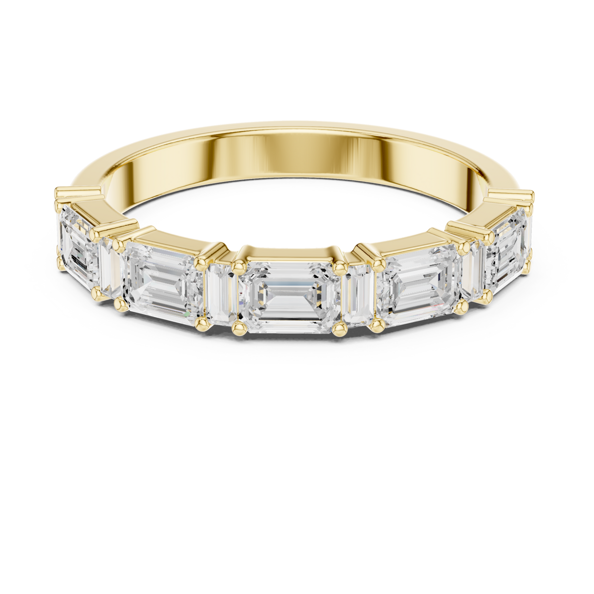 Emerald and baguette east-west half band yellow gold detail view