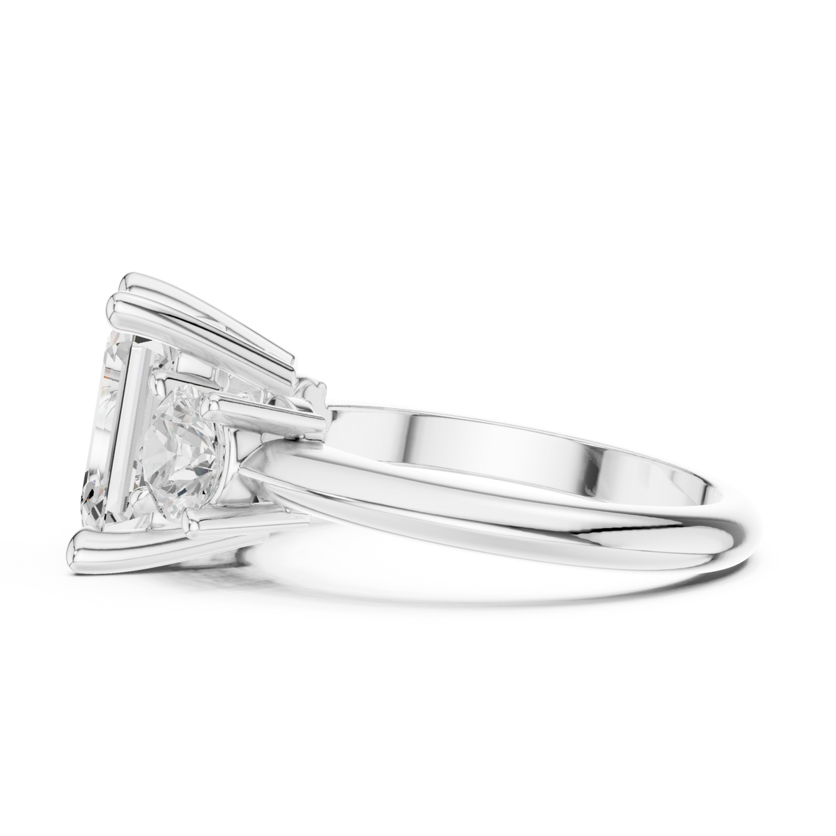Emerald classic three stone engagement ring white gold side view