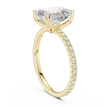 Emerald claw-prong pave engagement ring yellow gold front view