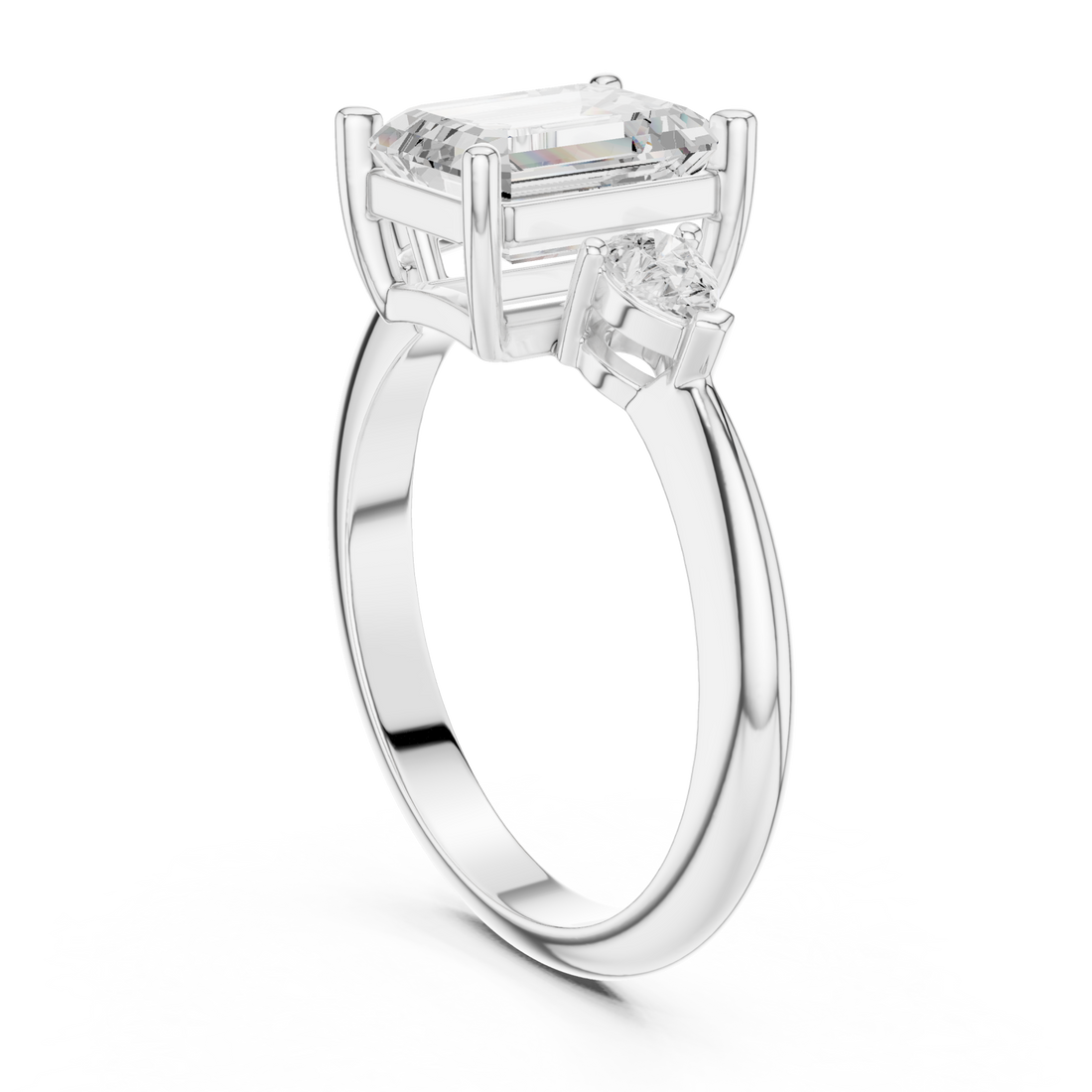 Emerald east-west pear three stone engagement ring white gold front view