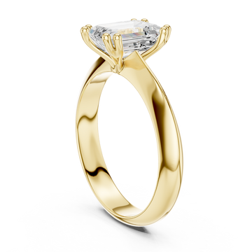 Emerald knife-edge solitaire engagement ring yellow gold front view