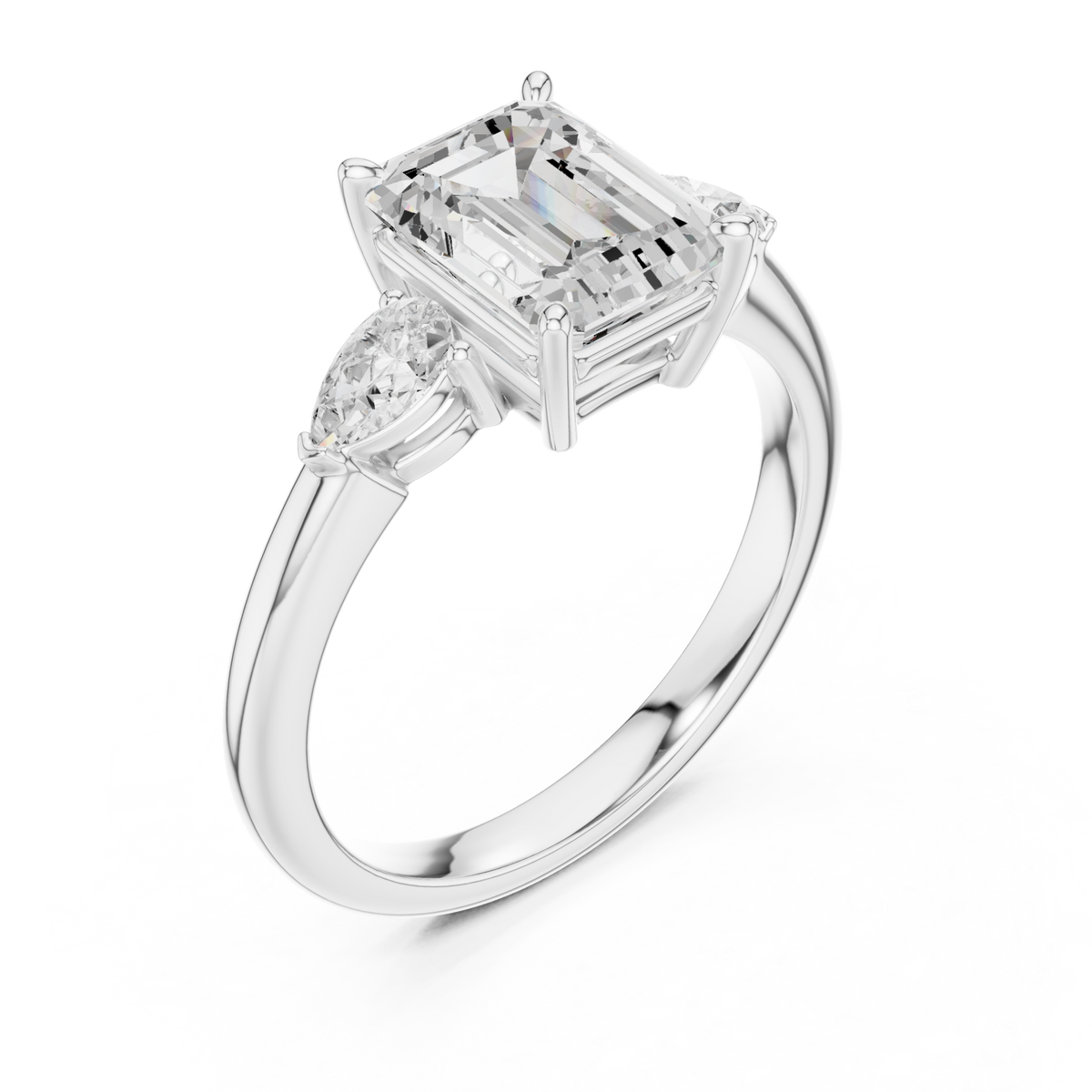 Emerald pear side three stone engagement ring white gold angle view
