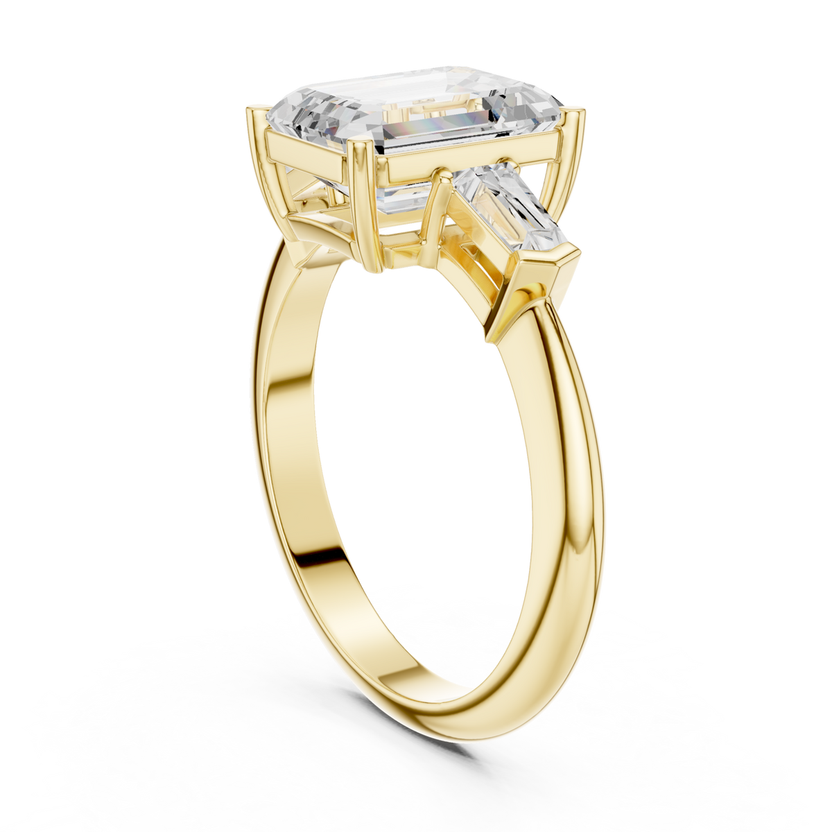 Emerald petite baguette three stone engagement ring yellow gold front view
