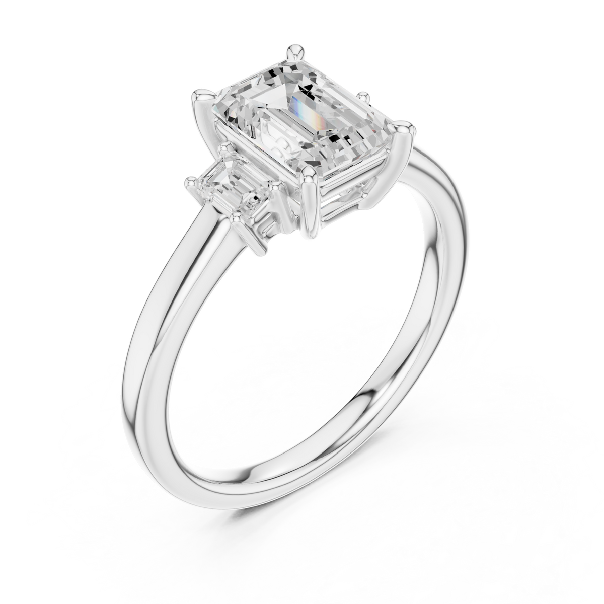 Emerald side three stone engagement ring white gold angle view