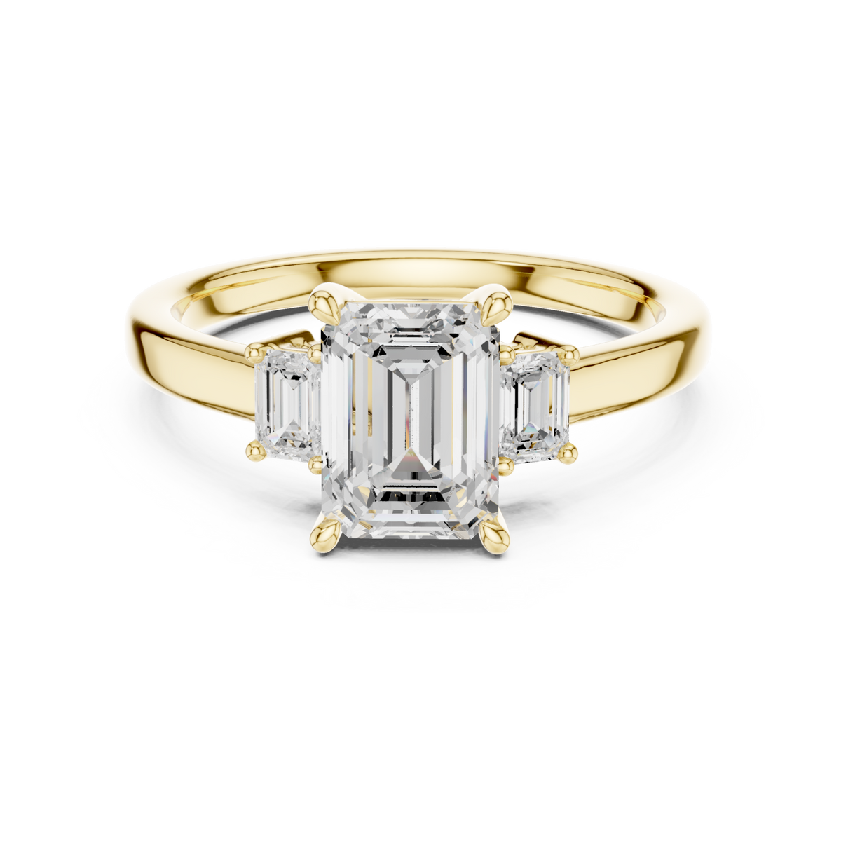 Emerald side three stone engagement ring yellow gold detail view