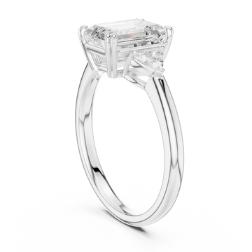 Emerald trillion side three stone engagement ring white gold front view