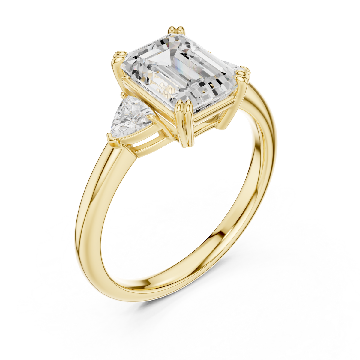 Emerald trillion side three stone engagement ring yellow gold angle view