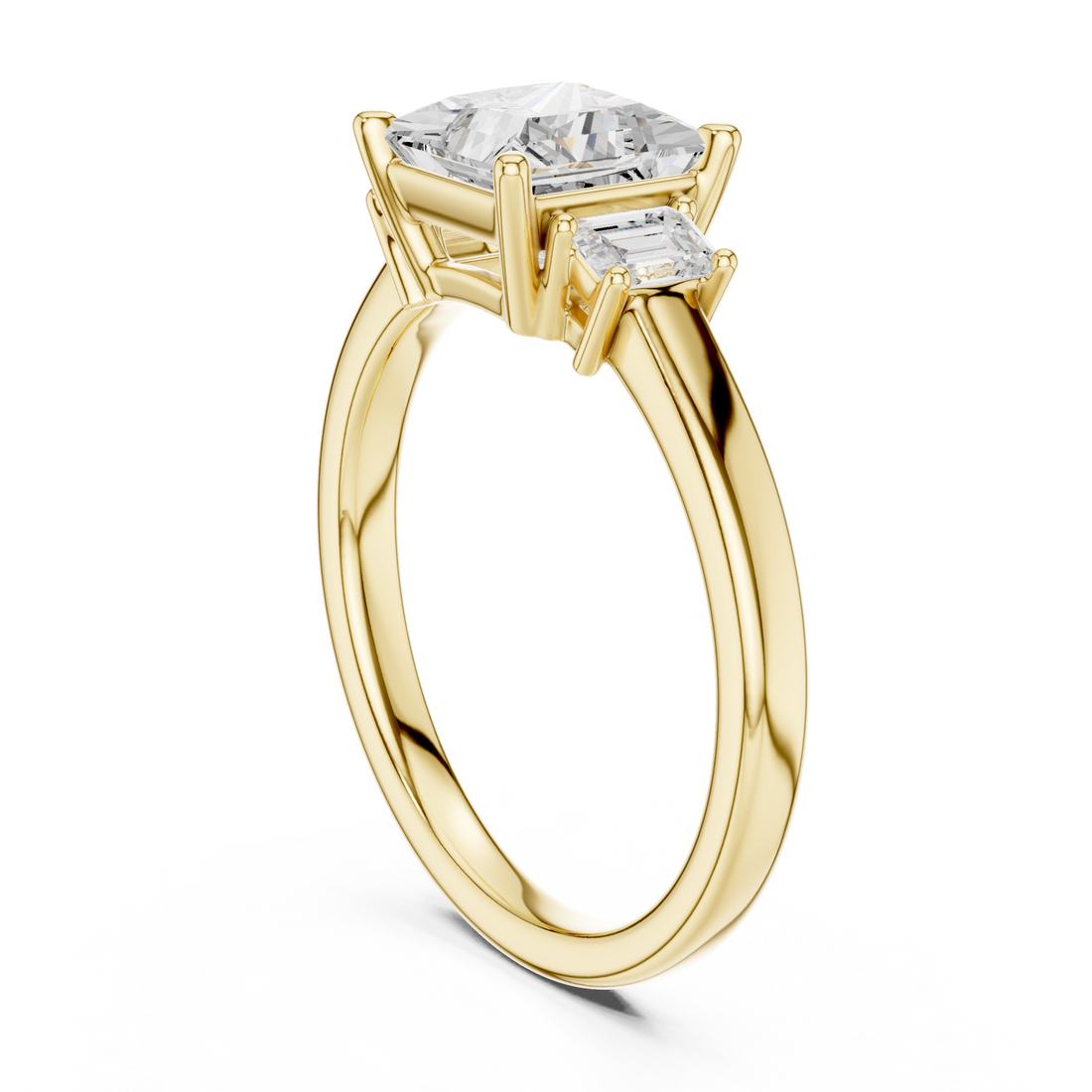 Pear emerald side three stone engagement ring yellow gold front view