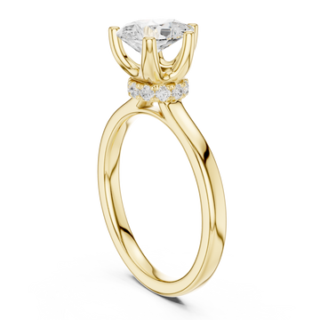 Pear petite hidden halo solitaire engagement ring yellow gold front view