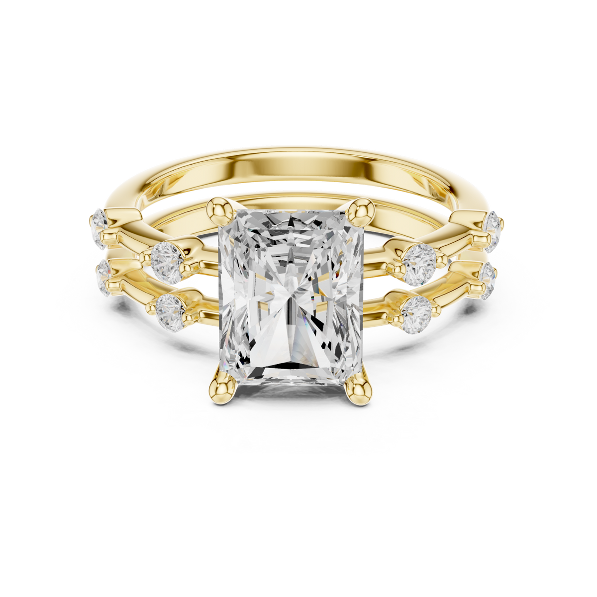 Radiant spaced accent bridal set yellow gold detail view