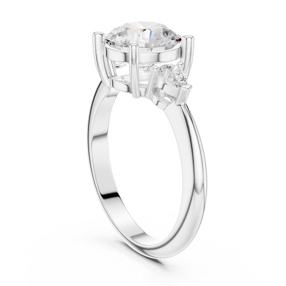 Round east-west pear three stone engagement ring white gold front view